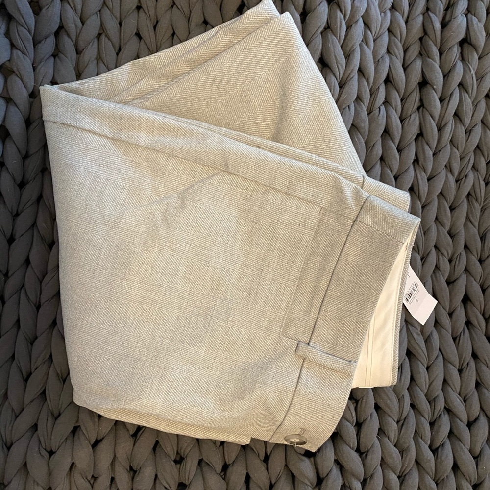 Light gray herringbone pants.